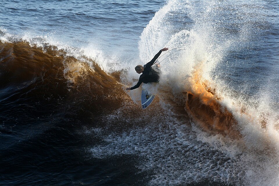 Surfer riding an ocean wave